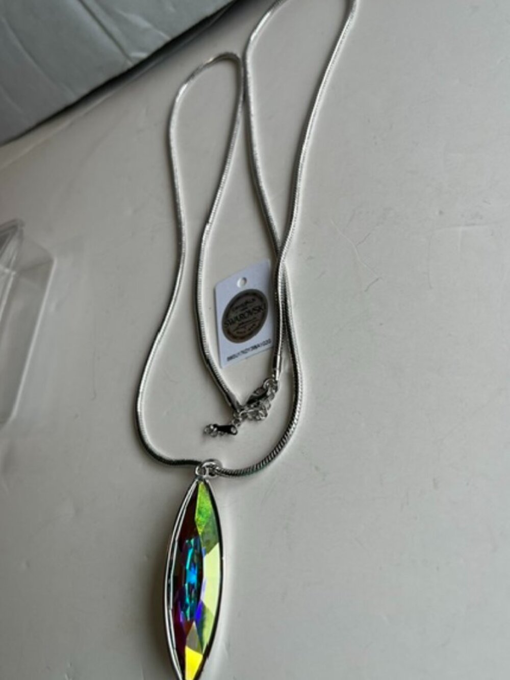 Swarovski aurore boreale cat eyed crystal pendant and necklace.
